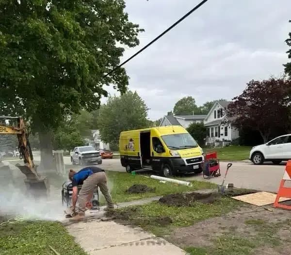 Triple service working on habitat for humanity home