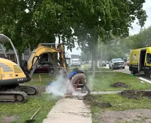 Triple service working on habitat for humanity home