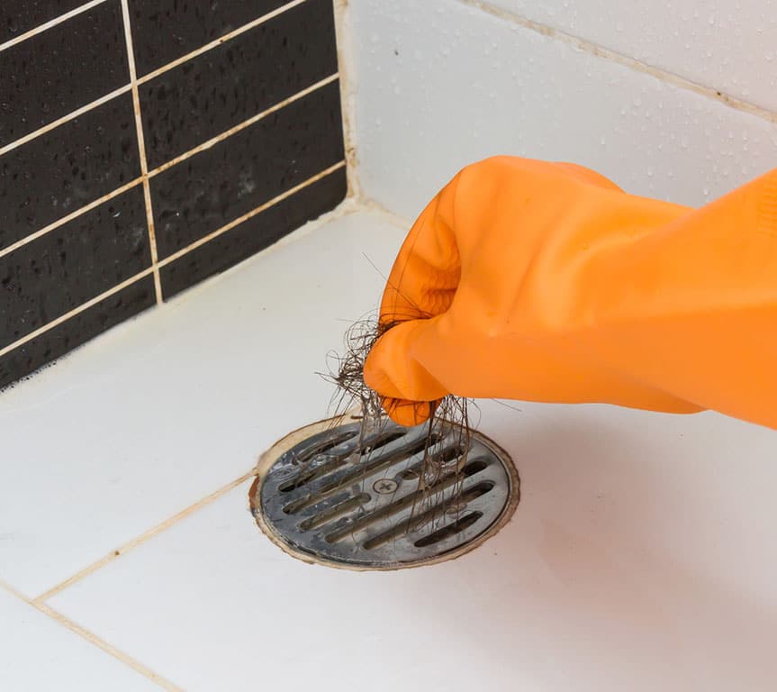 removing a hair clog from a shower drain