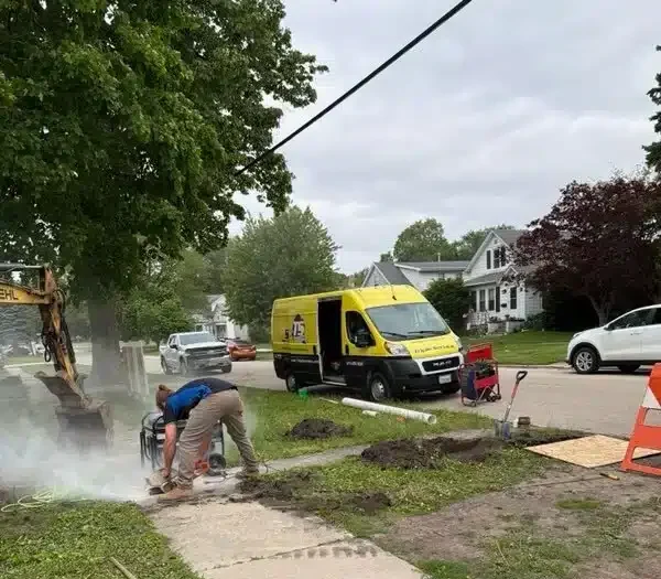 Triple service working on habitat for humanity home
